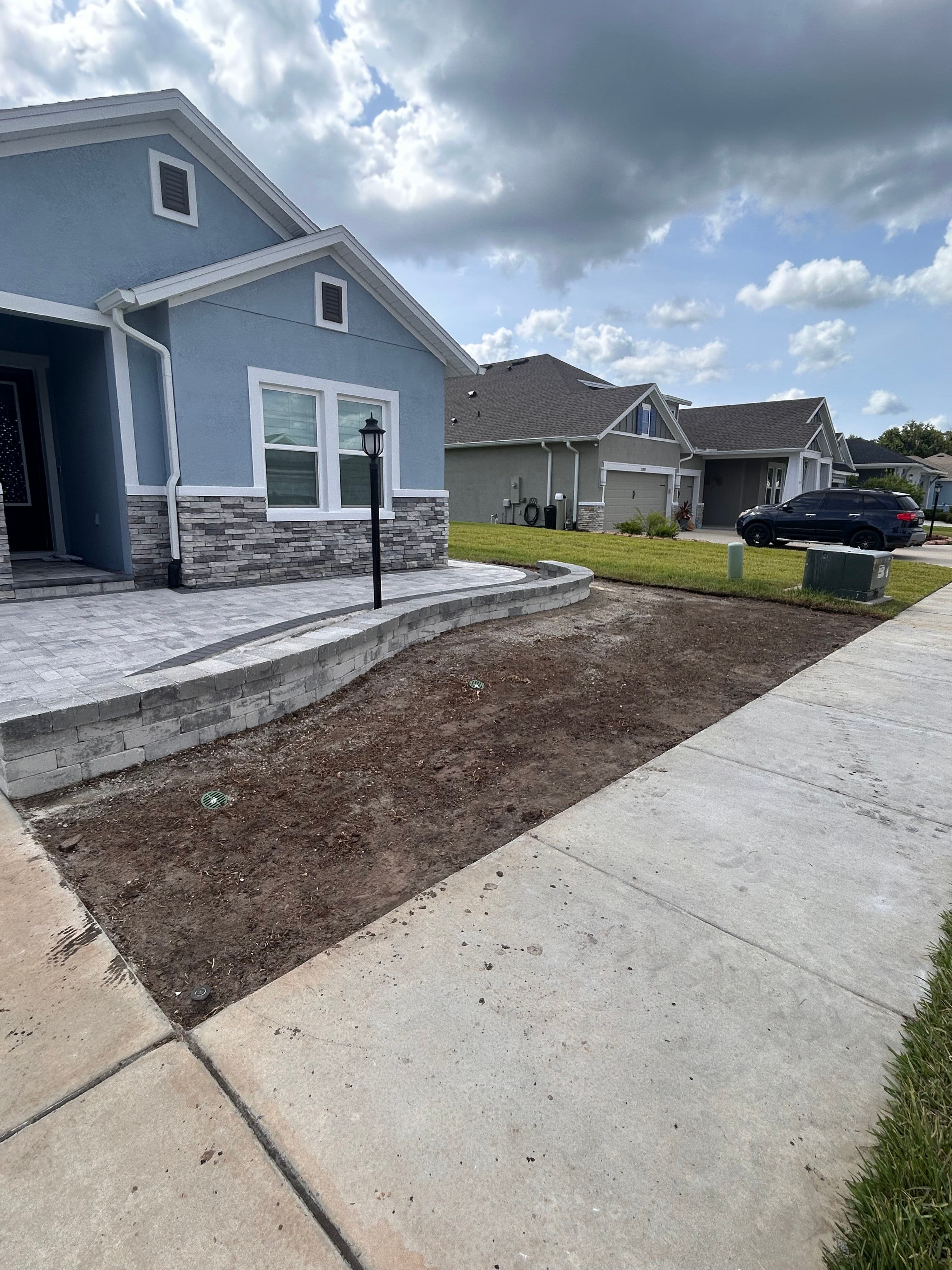 Project Drainage Correction and Bahia Sod Install Next to a New Paver Patio image