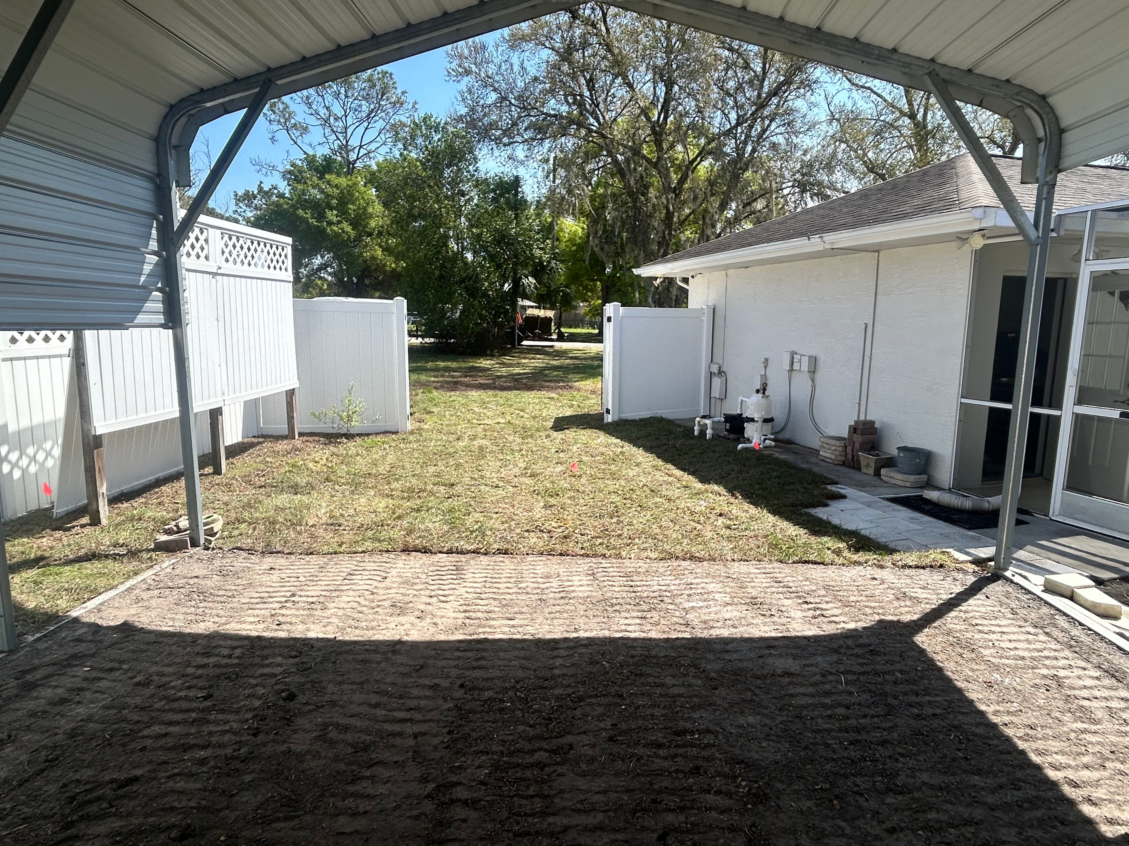 Project Carport Grading, Asphalt Millings, and Bahia Sod Backyard Fix image