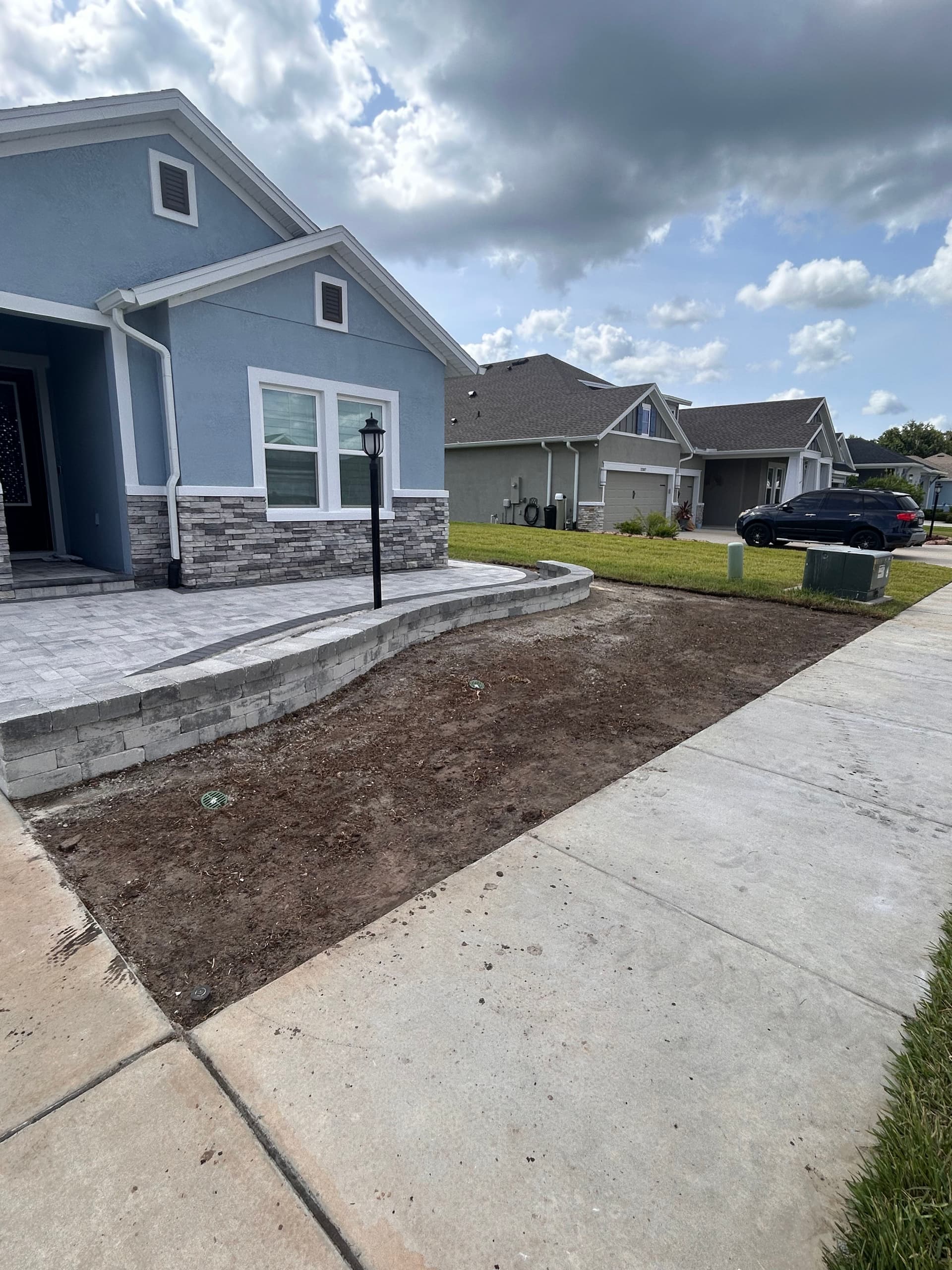 Drainage Correction and Bahia Sod Install Next to a New Paver Patio image