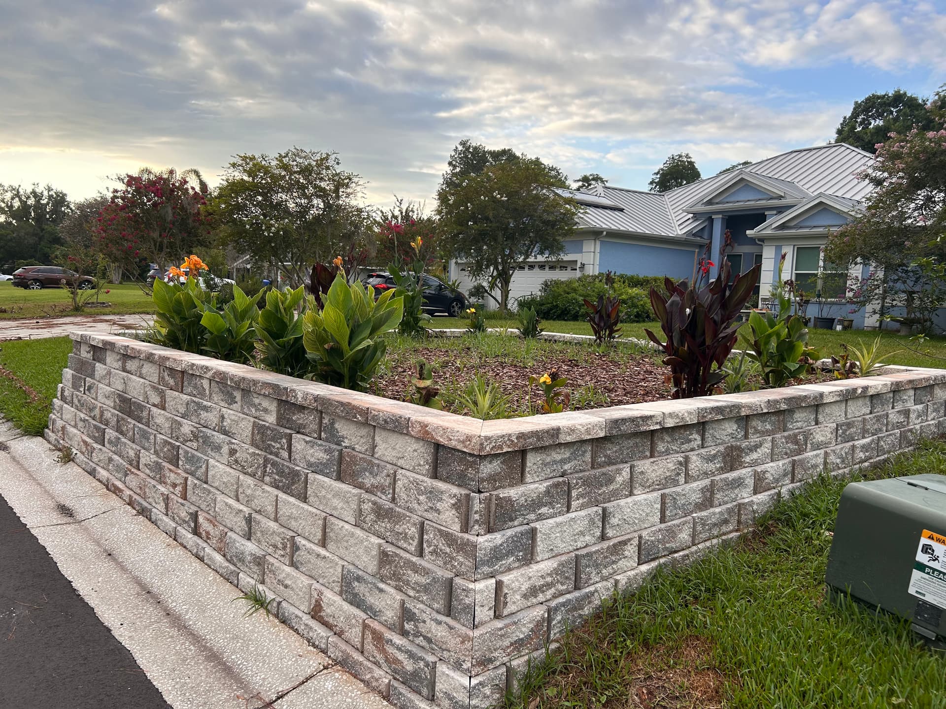 Stone Retaining Wall Garden Bed Built After Storm Damage image